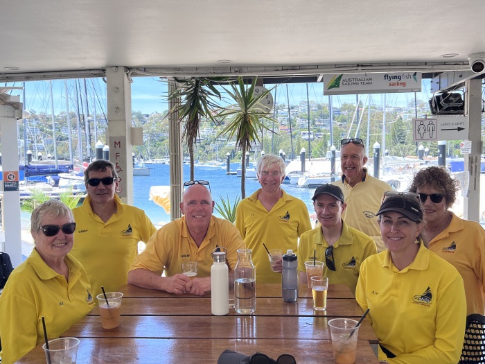 Volunteers having a drink and catch up after sailing